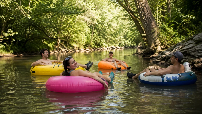 Relaxed river tubing on a tree-lined Southern Indiana creek